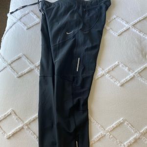 Nike women tight. Zipper at ankle, reflectors, great for running